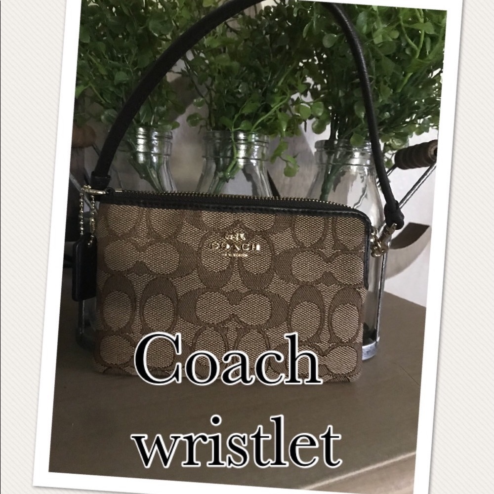 Brown/tan Coach wristlet